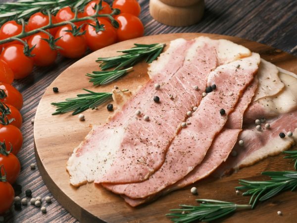 raw meat on brown wooden chopping board